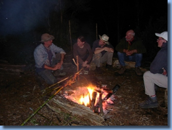 People around the fire  on a 2 day ride in Pucon, Chile